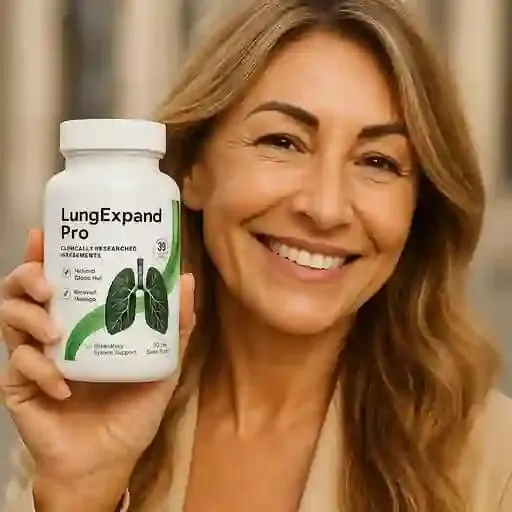 Smiling woman giving a positive LungExpand Pro review while holding the supplement bottle